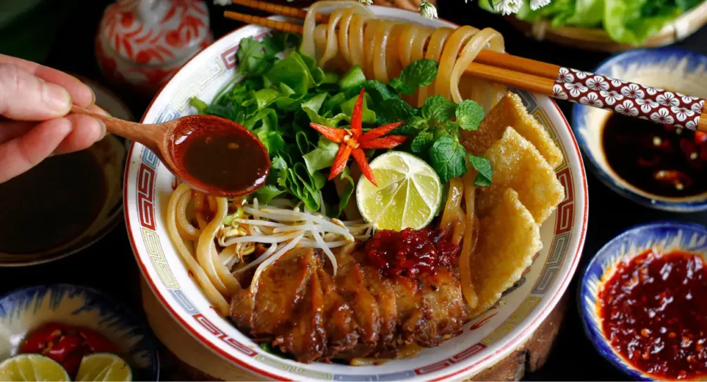 Cao Lau-Pork Noodle Dish - AN Tours Vietnam