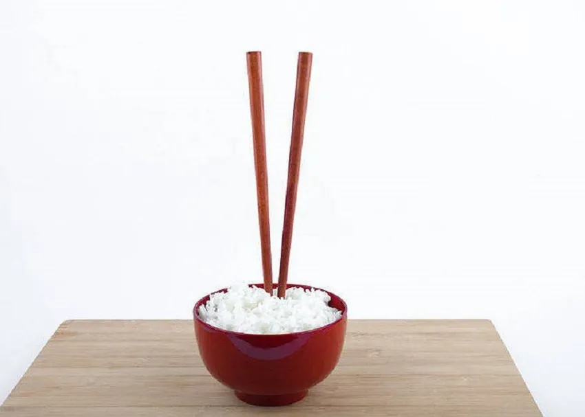 Do not stick chopsticks into the rice bowl - AN Tours Vietnam
