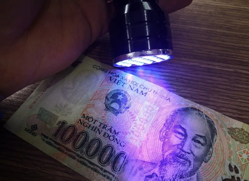 Micro-Printing and UV Light Test to spot fake Vietnam Dong