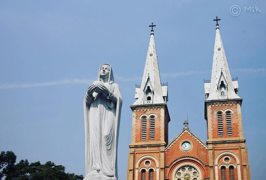 Statue of Peaceful Notre Dame in front of the church
