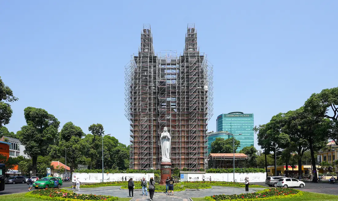 Visitors still enjoy taking photos of Notre Dame Cathedral Saigon - though it is under construction