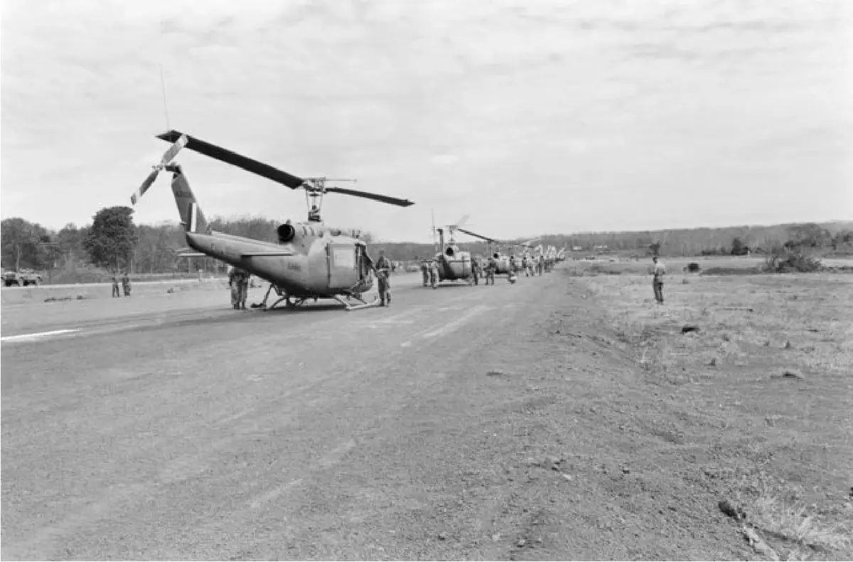 17 Feb 1967 - Iroquois helicopters and crewmen from No 9 Squadron, line up on Luscombe Field