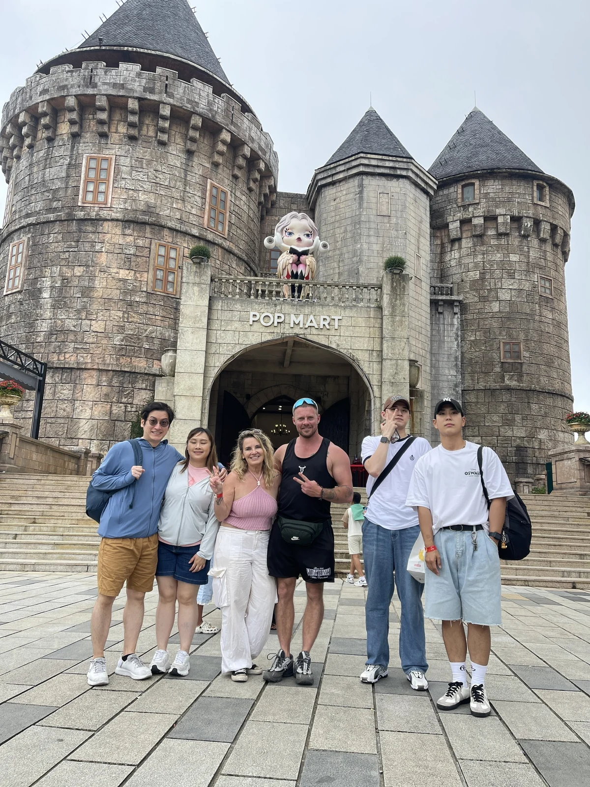 Tour guests at the stone towers in Ba Na Hills French Village