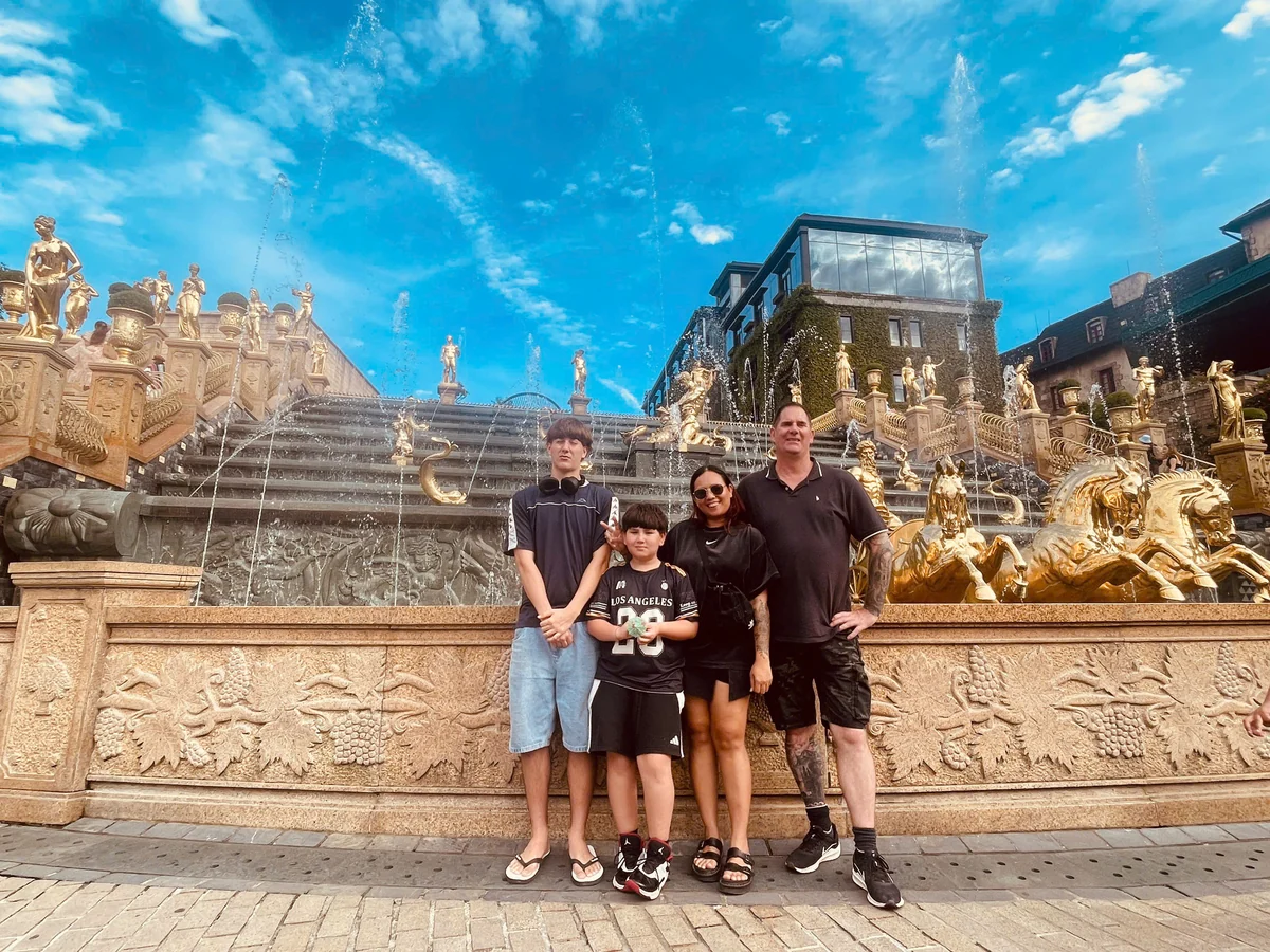 Tour guests in front of the Helios Waterfall at Ba Na Hills